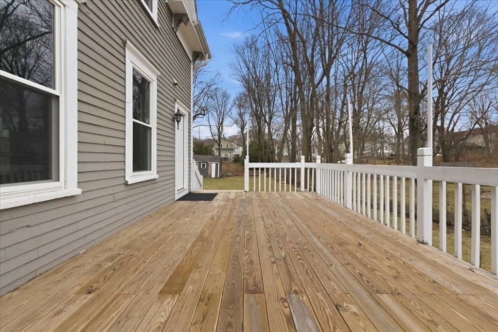 163 West Central Street Franklin, MA 02038 - Photo 5 of 39 a view of a wooden deck