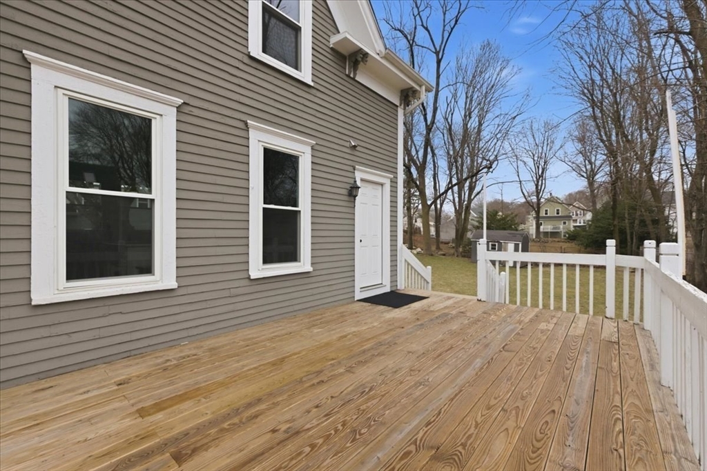 163 West Central Street Franklin, MA 02038 - Photo 6 of 39 a view of backyard with deck and wooden floor