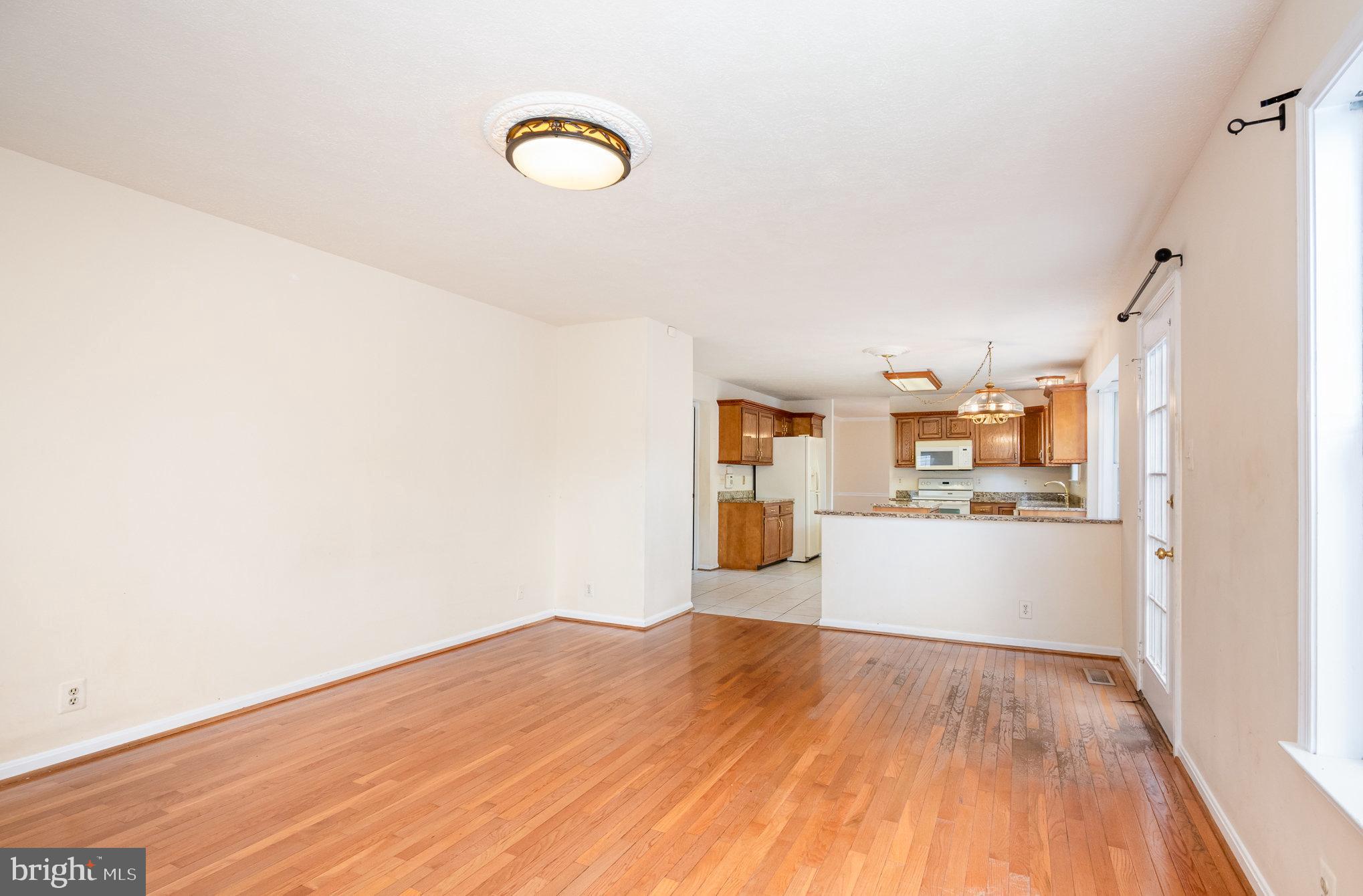 10402 Labrador Loop Manassas, VA 20112 - Photo 11 of 44 a view of a kitchen with wooden floor