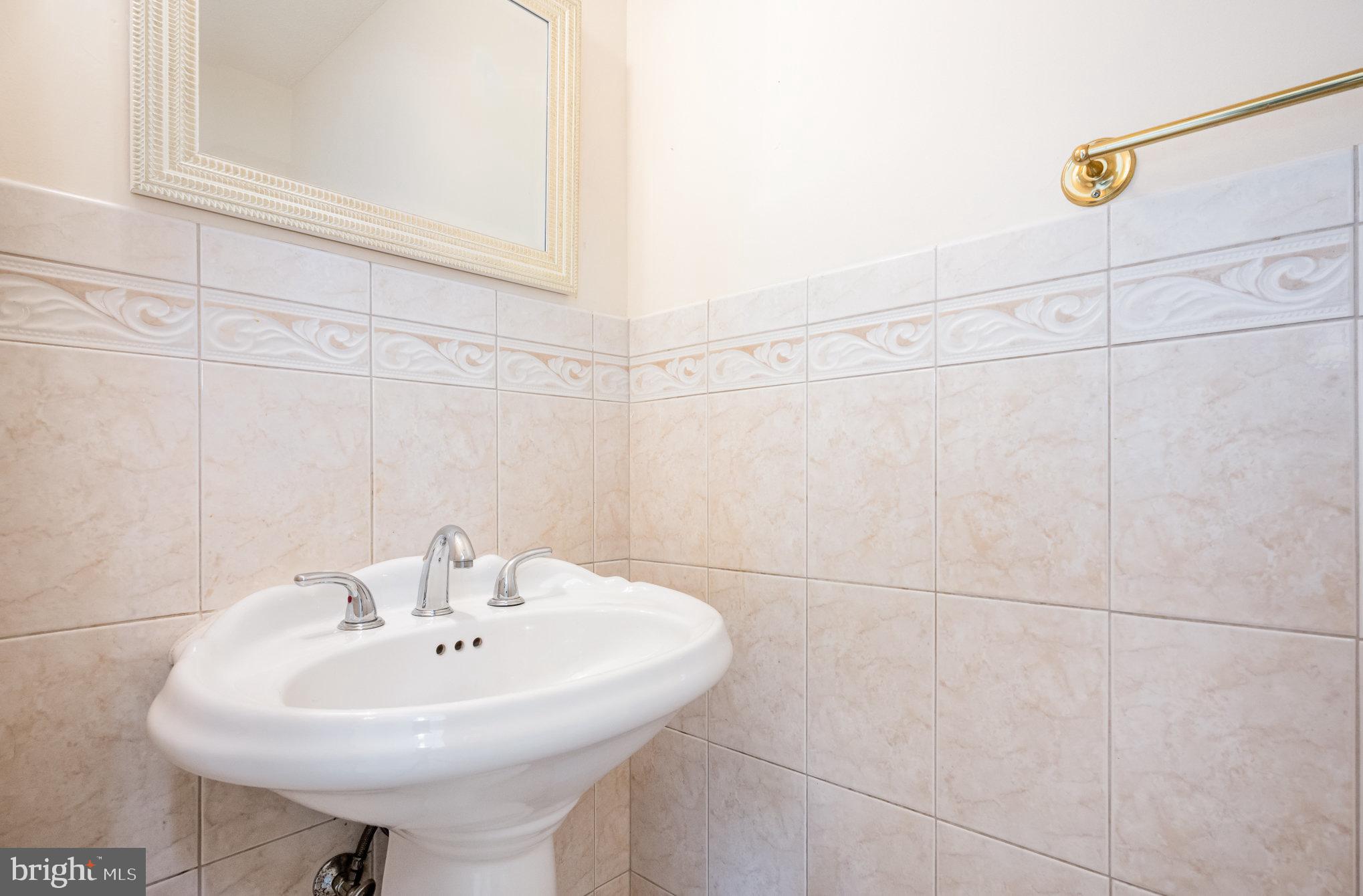 10402 Labrador Loop Manassas, VA 20112 - Photo 14 of 44 a bathroom with a sink and a mirror