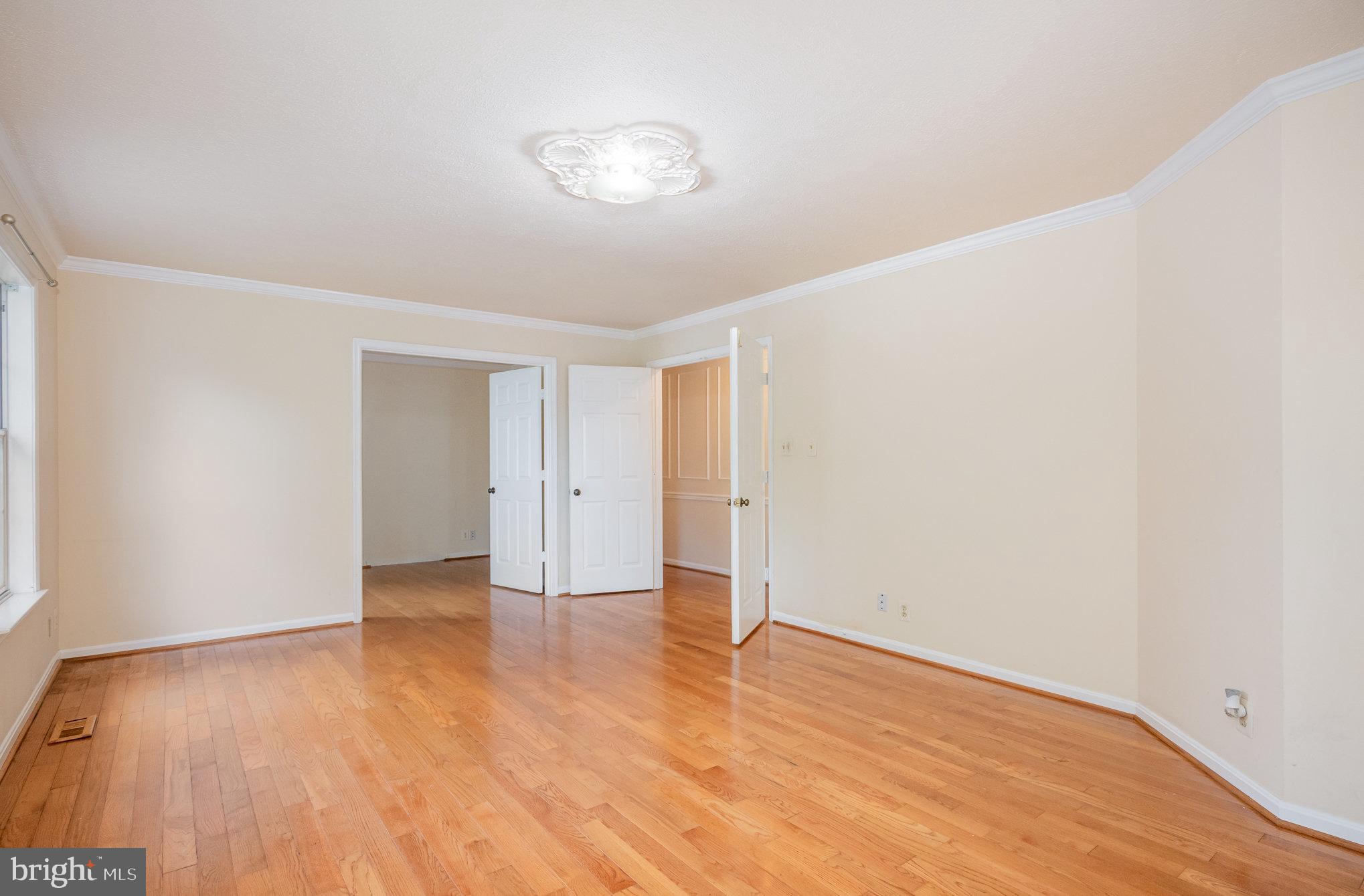 10402 Labrador Loop Manassas, VA 20112 - Photo 18 of 44 a view of an empty room with wooden floor