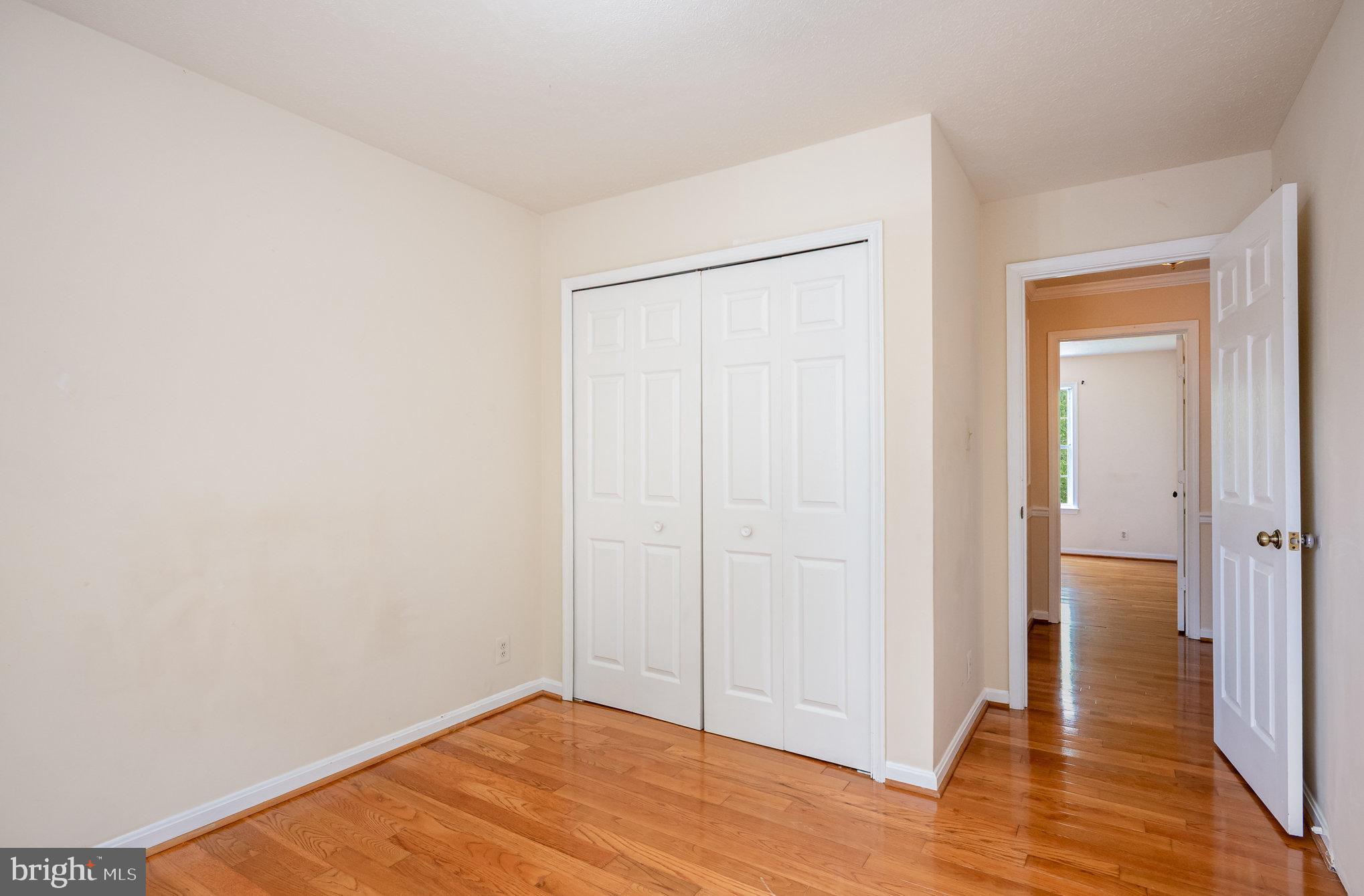 10402 Labrador Loop Manassas, VA 20112 - Photo 26 of 44 a view of a room with wooden floor and closet