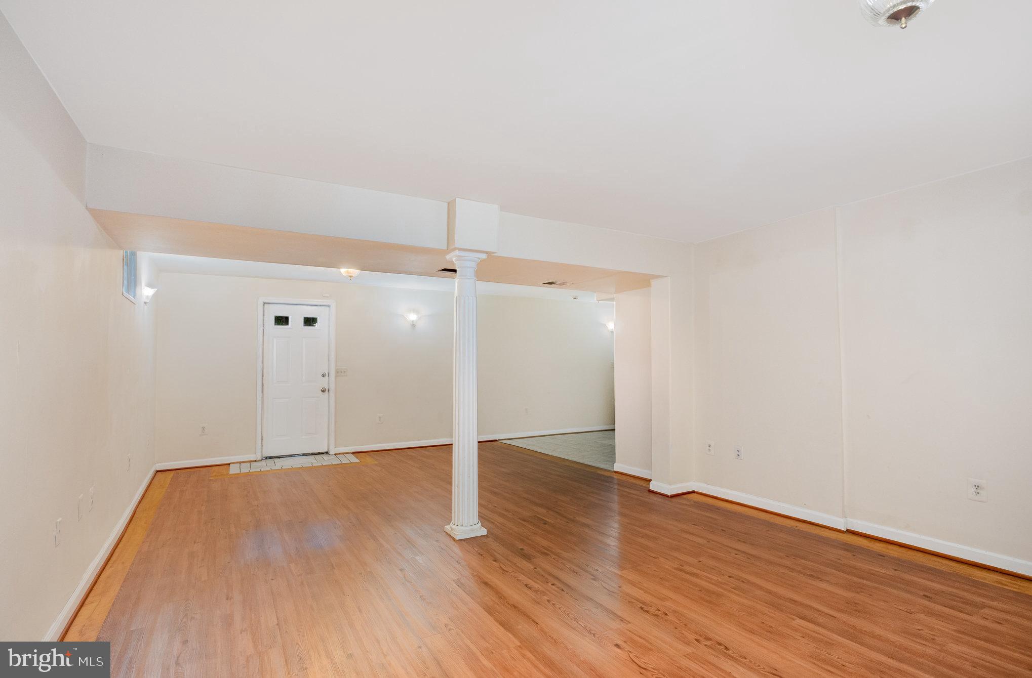 10402 Labrador Loop Manassas, VA 20112 - Photo 35 of 44 an empty room with wooden floor
