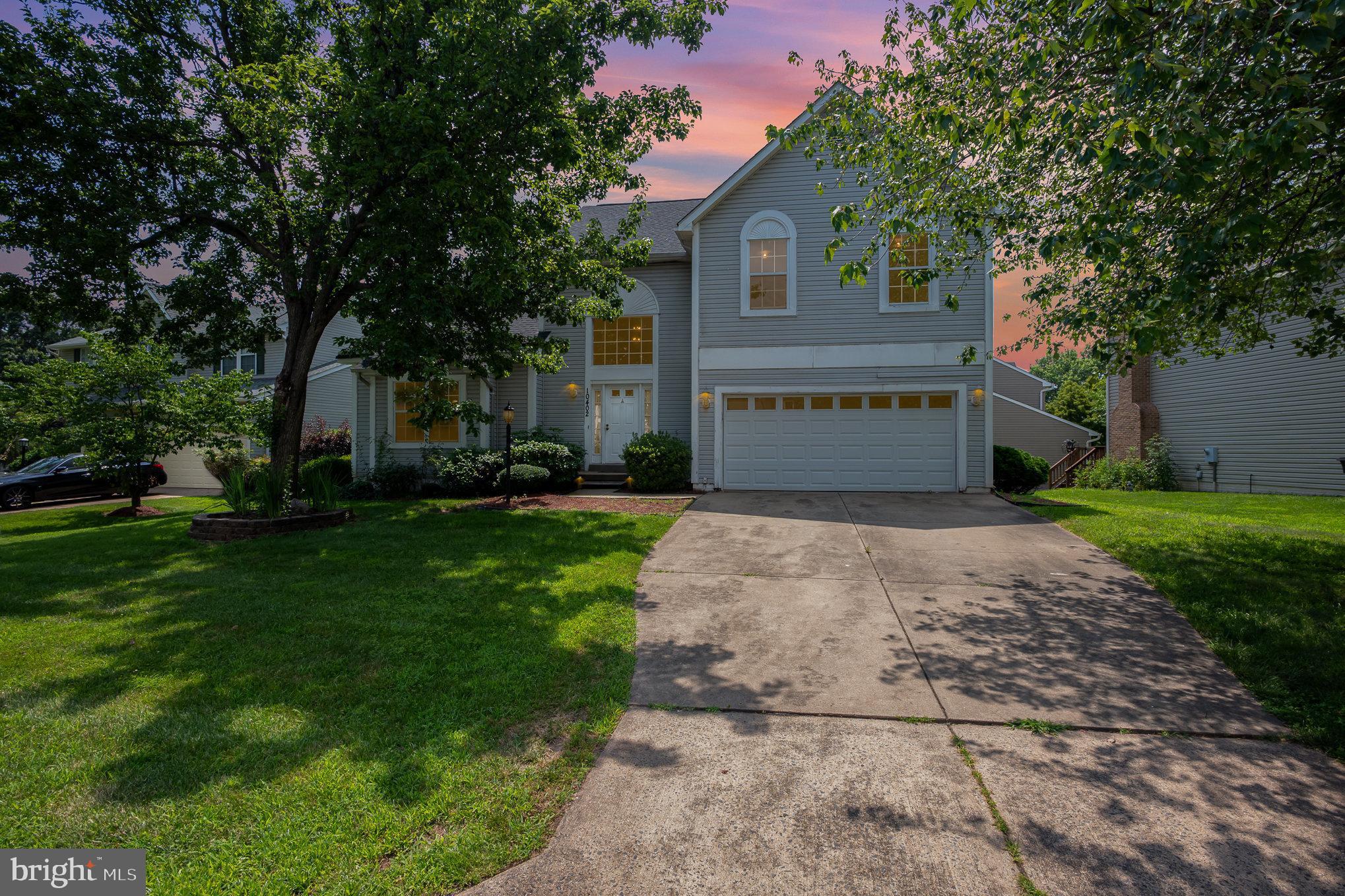 10402 Labrador Loop Manassas, VA 20112 - Photo 44 of 44 a front view of house with yard and trees all around