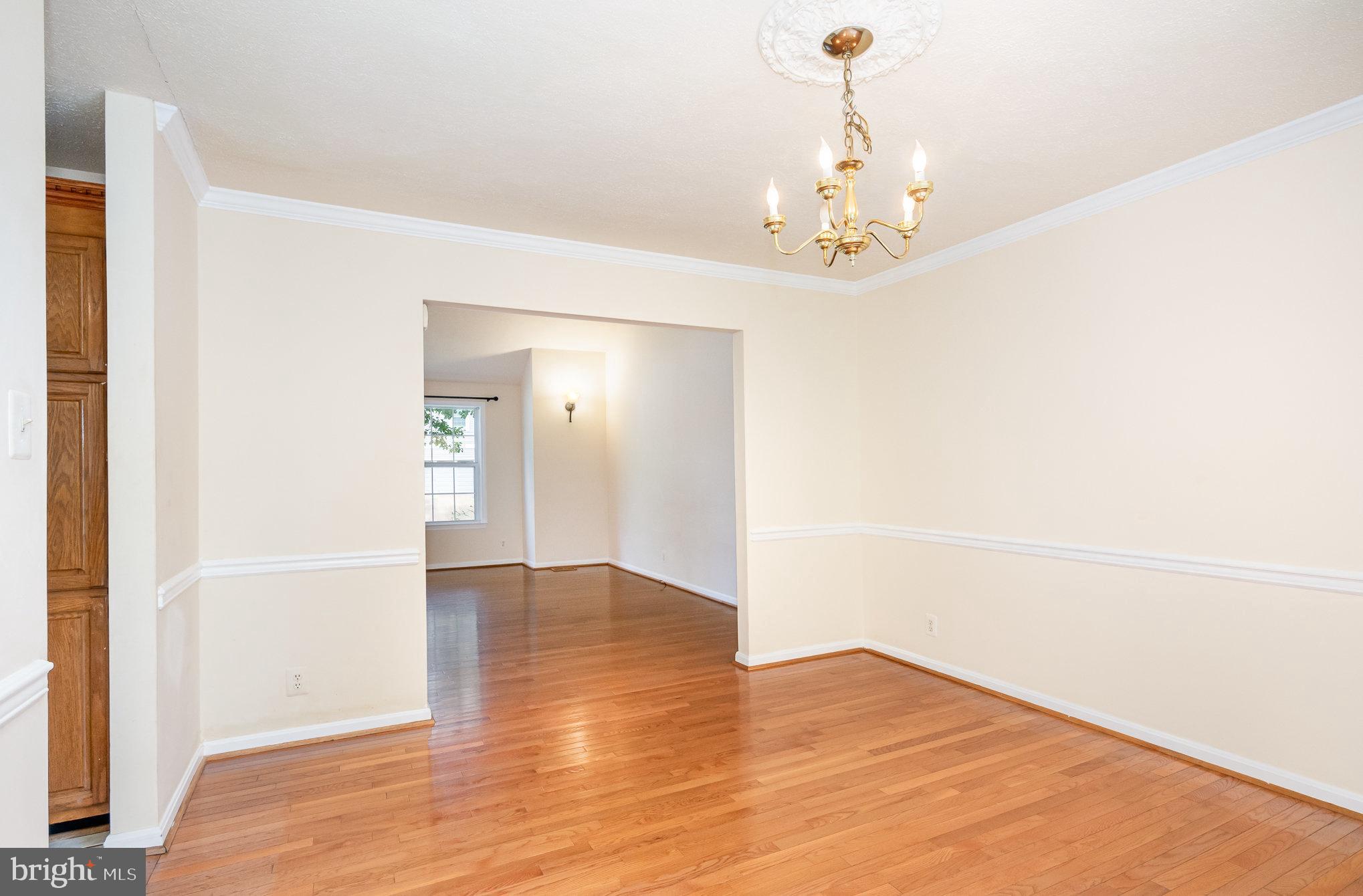 10402 Labrador Loop Manassas, VA 20112 - Photo 6 of 44 a view of a chandelier in an empty room
