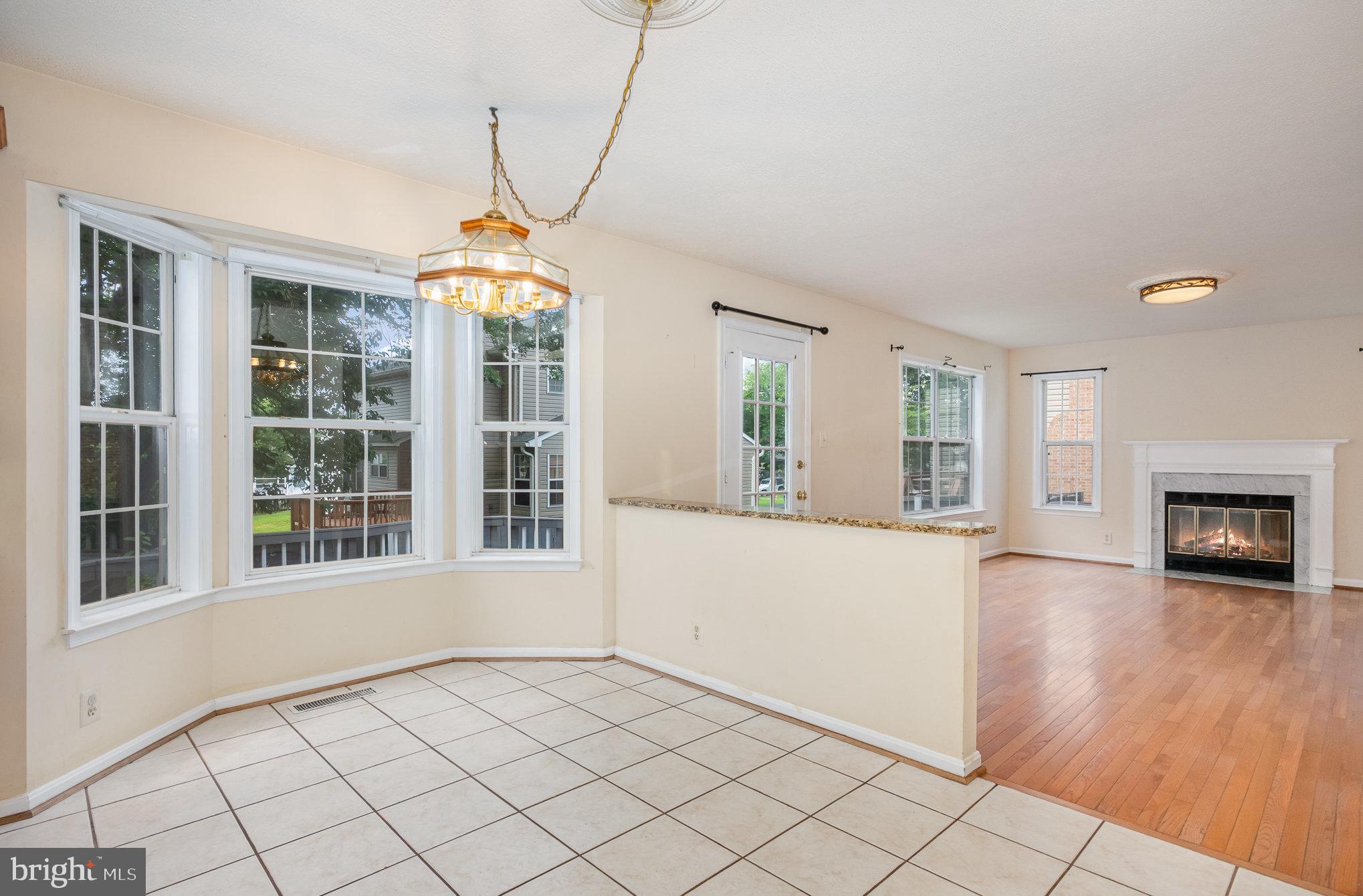 10402 Labrador Loop Manassas, VA 20112 - Photo 10 of 44 a view of an empty room with window and fire place