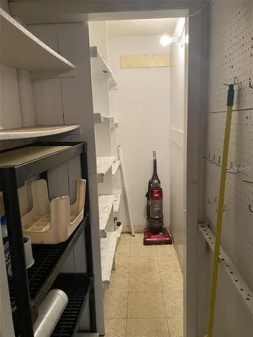 a view of a livingroom with furniture and entryway