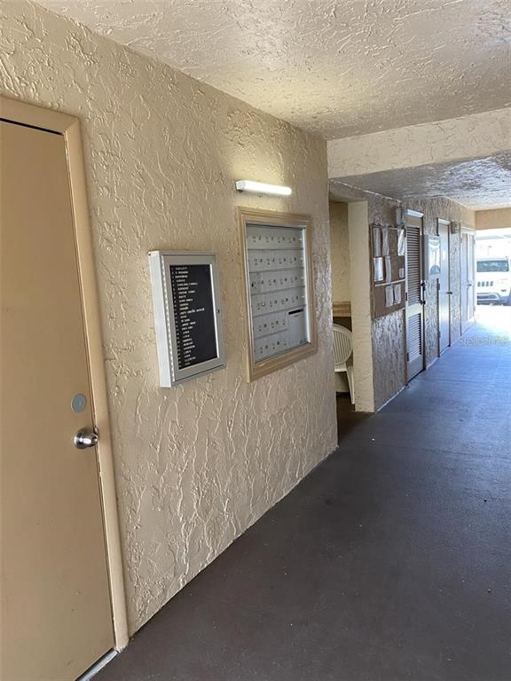 10033 64th Avenue North, Unit 1 St. Petersburg, FL 33708 - Photo 22 of 26 a view of hallway with livingroom