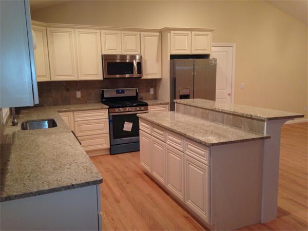 7 Birch Road Freetown, MA 02702 - Photo 3 of 15 a kitchen with granite countertop a sink stove and refrigerator