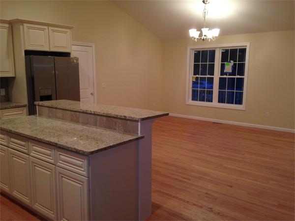7 Birch Road Freetown, MA 02702 - Photo 7 of 15 a view of a kitchen with a sink and wooden floor