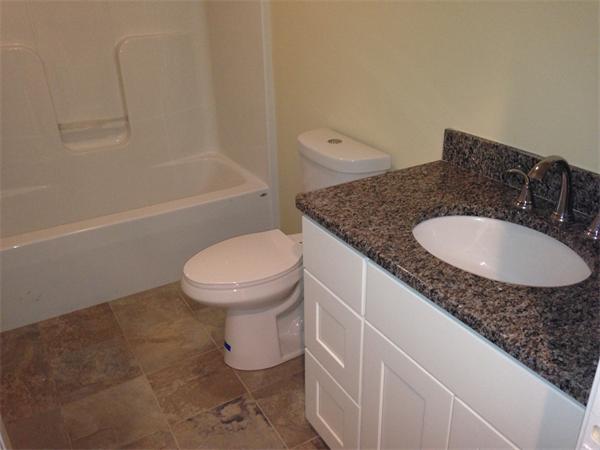 7 Birch Road Freetown, MA 02702 - Photo 9 of 15 a bathroom with a granite countertop sink a toilet and bathtub