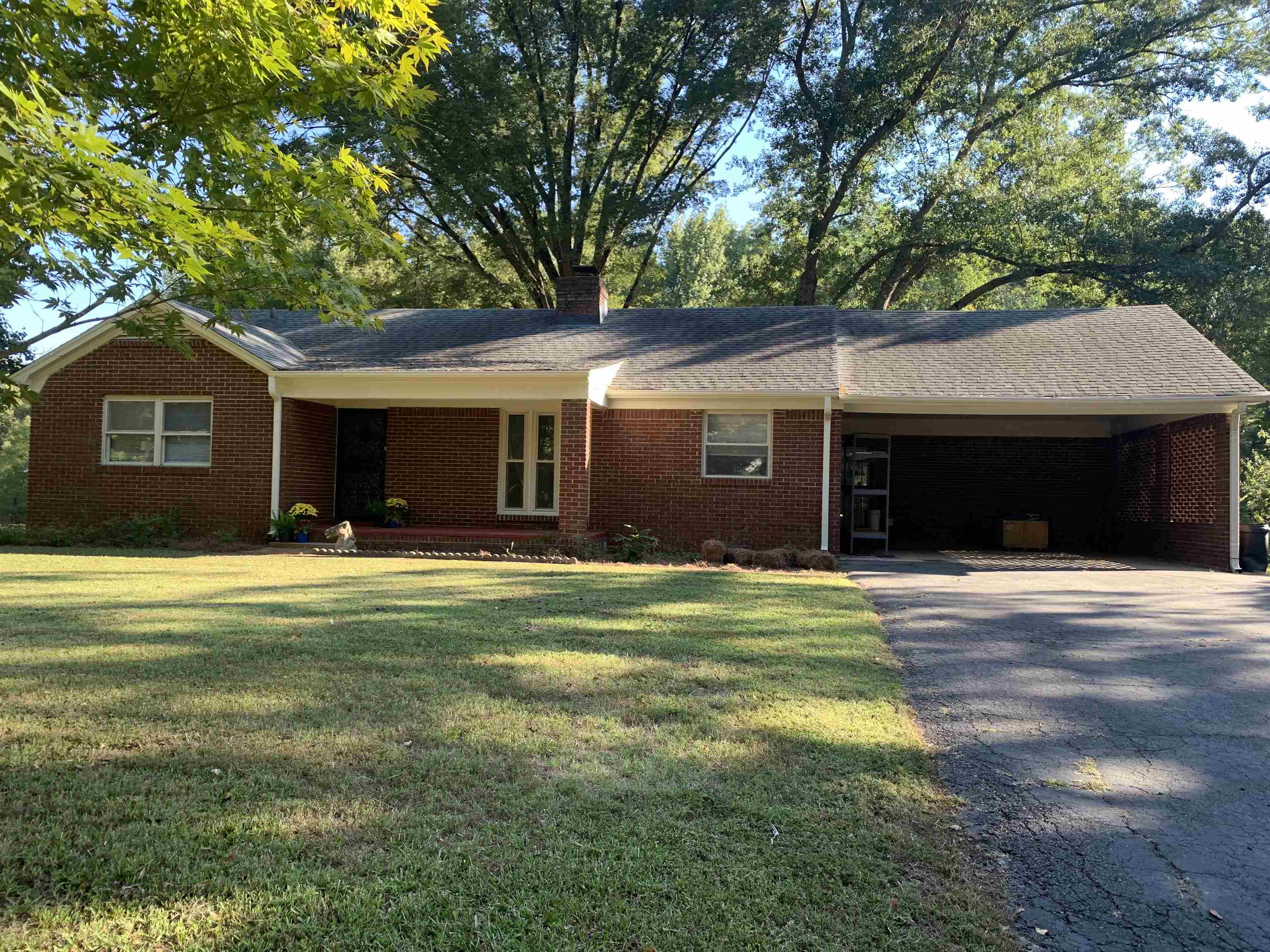 10339 Pleasant Ridge Road Arlington, TN 38002 - Photo 2 of 26 a front view of a house with a yard and garage