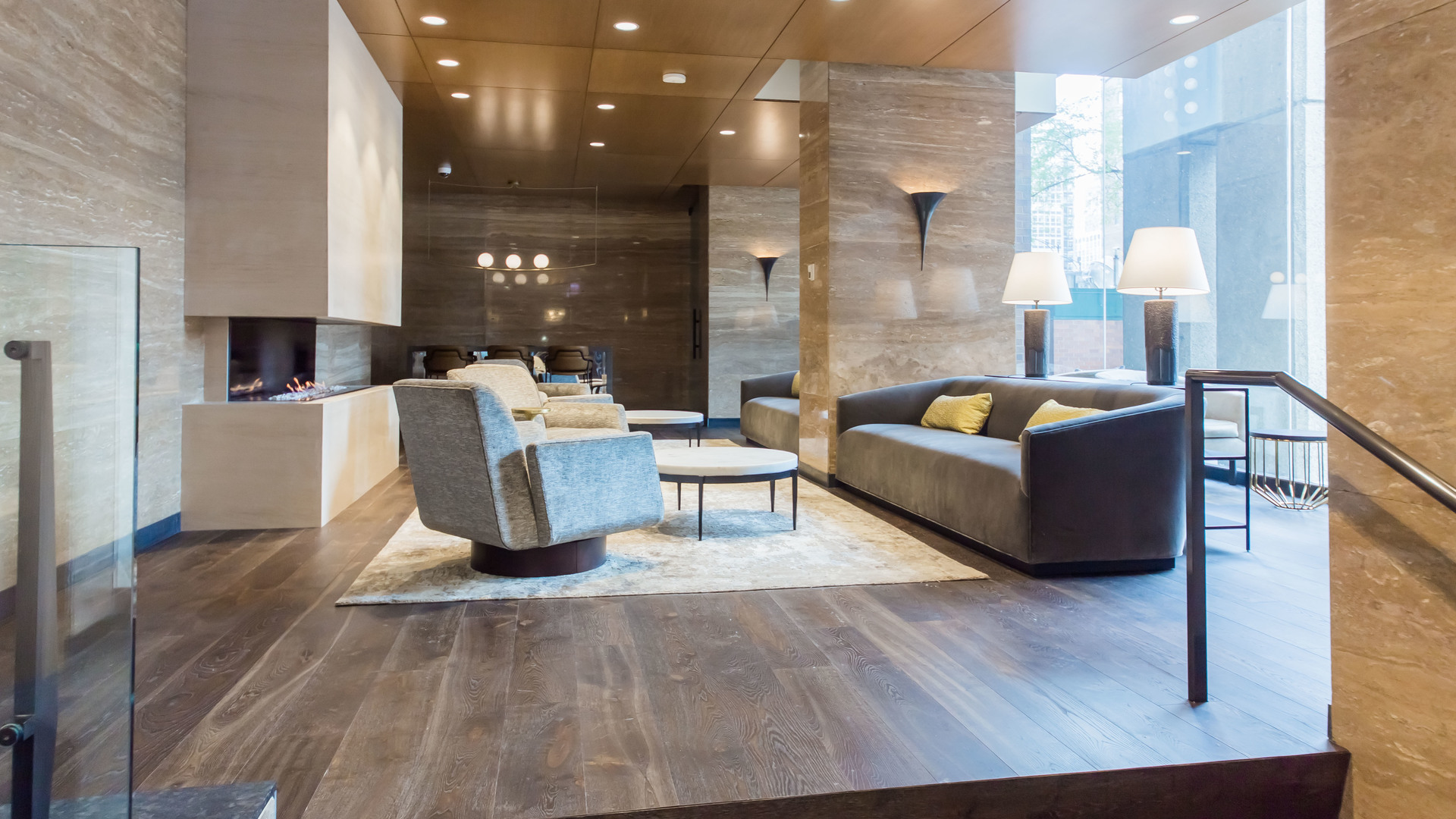 1030 North State Street, Unit 23F Chicago, IL 60610 - Photo 2 of 13 a living room with fireplace furniture and a wooden floor