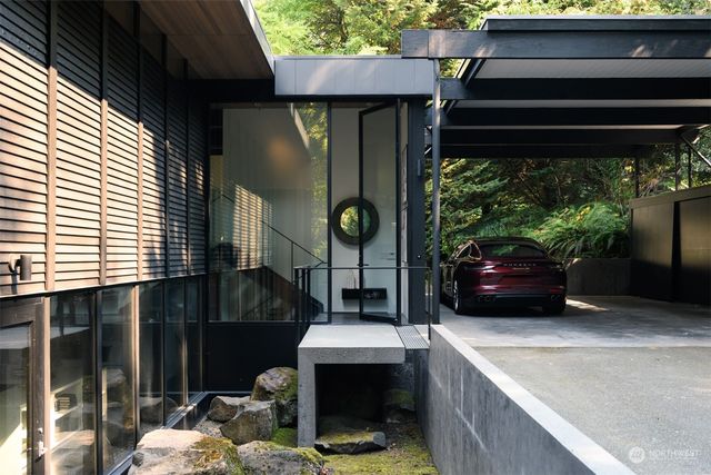 a living room with fireplace furniture and a window
