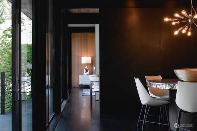 a dining room with furniture and wooden floor