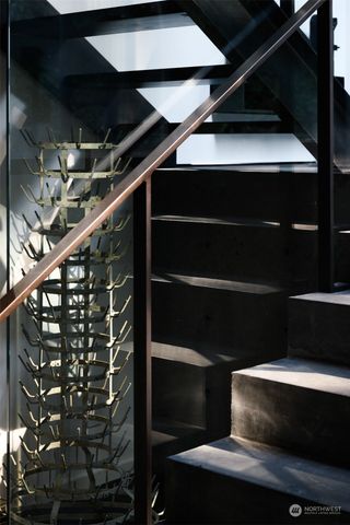 a living room with couches a coffee table and with view of living room