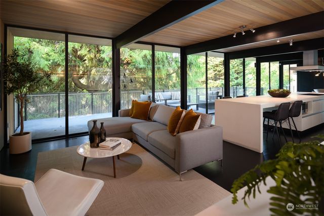 a view of a living room with furniture and chandelier