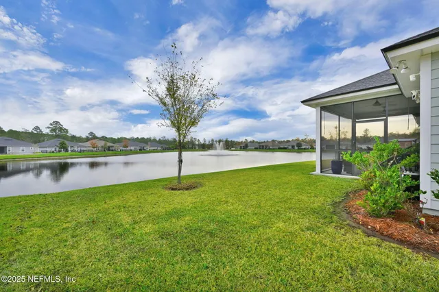 a view of a lake with a big yard