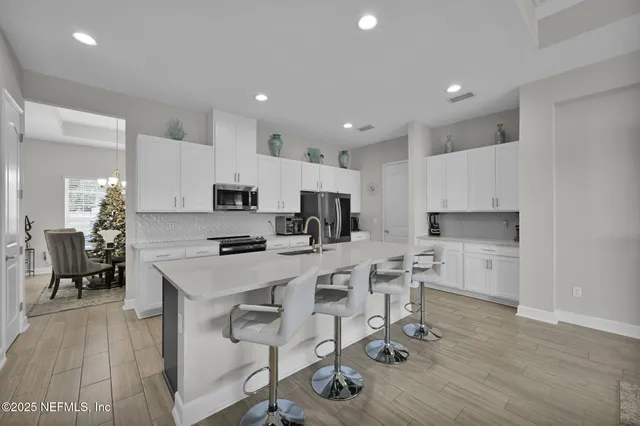 a kitchen with a sink a counter top space and appliances