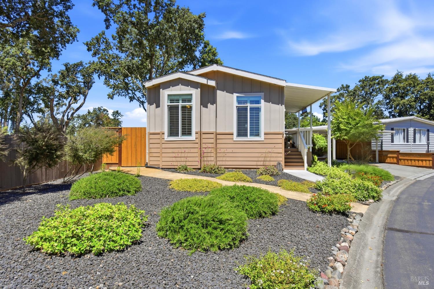 a front view of a house with garden