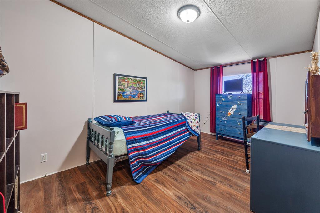 192 Big Salty Lane Springtown, TX 76082 - Photo 16 of 36 a room with furniture and a window