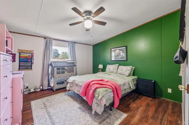 a bed room with a bed and a window