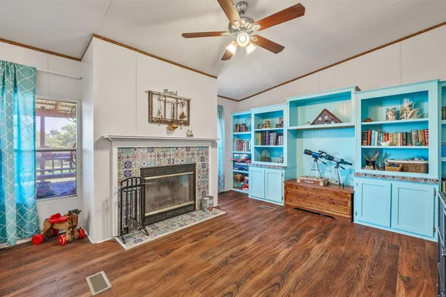 a living room with furniture and a fireplace