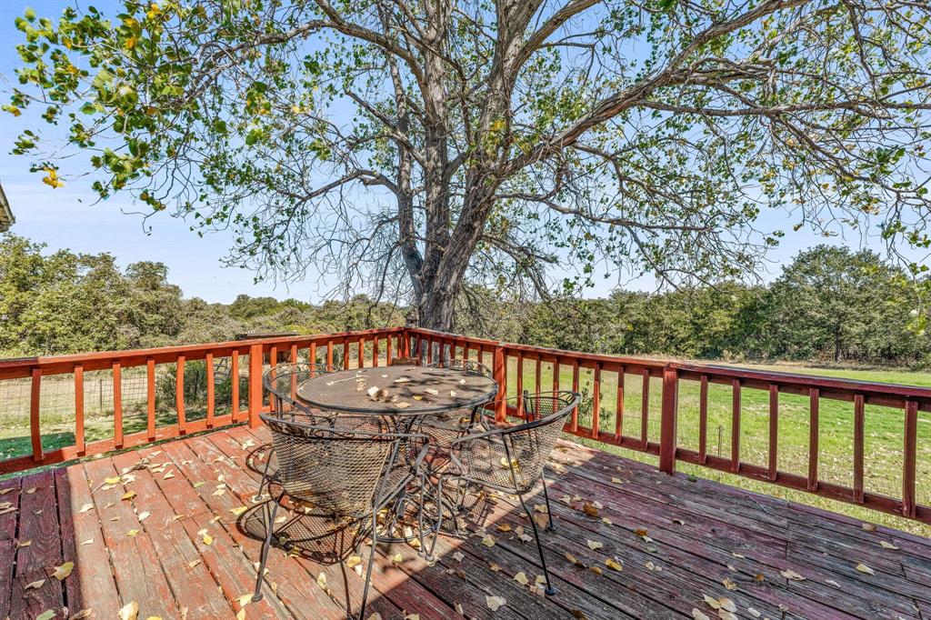 192 Big Salty Lane Springtown, TX 76082 - Photo 26 of 36 a view of a balcony with wooden floor