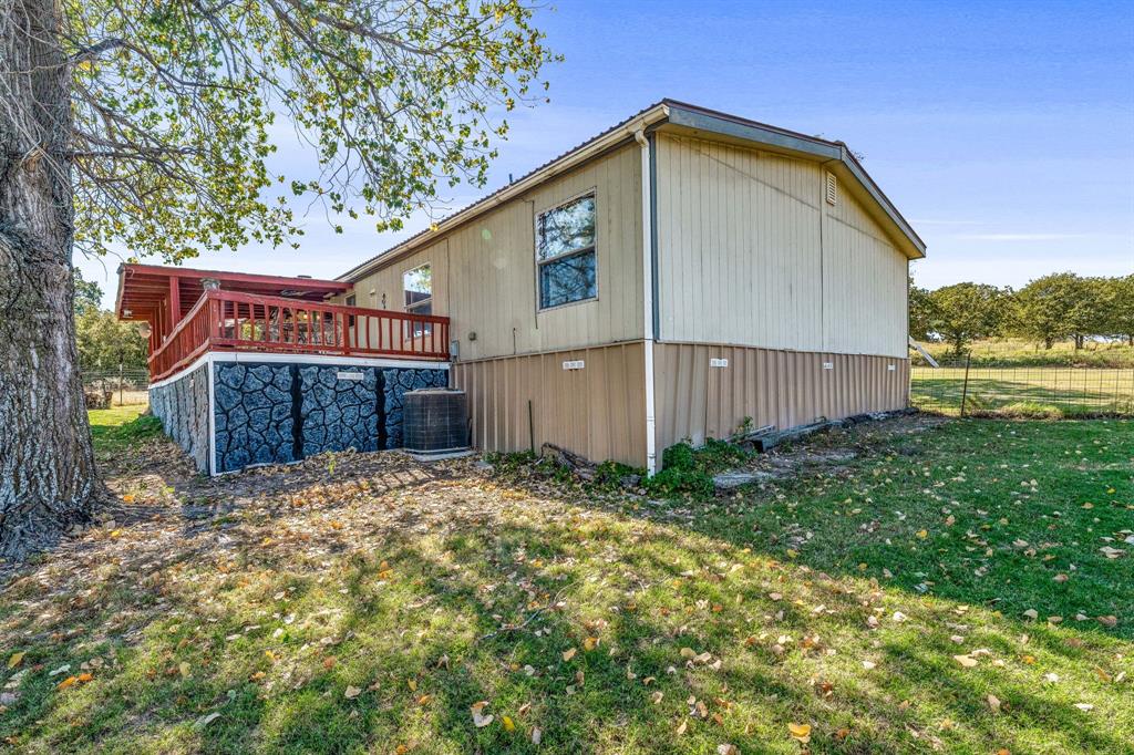 192 Big Salty Lane Springtown, TX 76082 - Photo 29 of 36 a front view of a house with garden