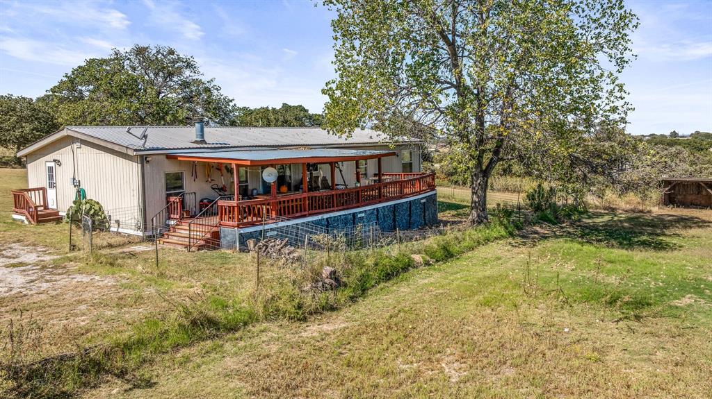 192 Big Salty Lane Springtown, TX 76082 - Photo 31 of 36 front view of a house with a yard