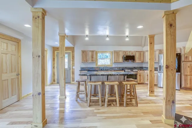 a view of a kitchen and dining room