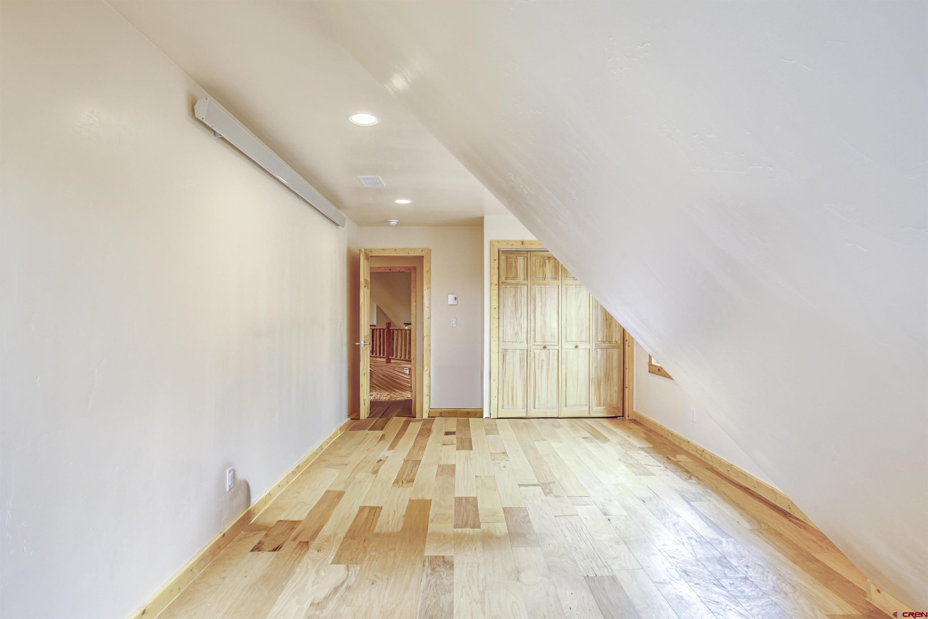 159 Snow Circle Pagosa Springs, CO 81147 - Photo 16 of 45 a view of hallway with wooden floor