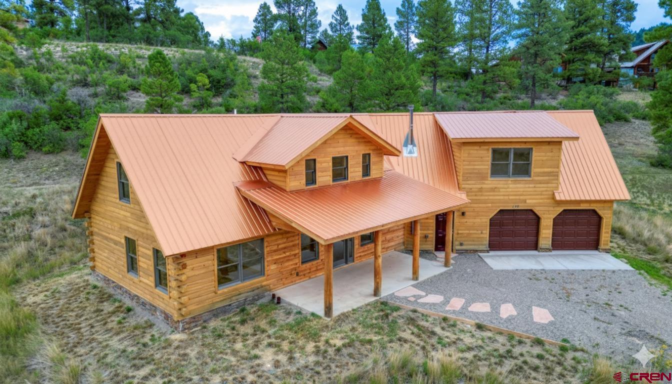 159 Snow Circle Pagosa Springs, CO 81147 - Photo 19 of 45 a aerial view of a house with a yard balcony and large tree