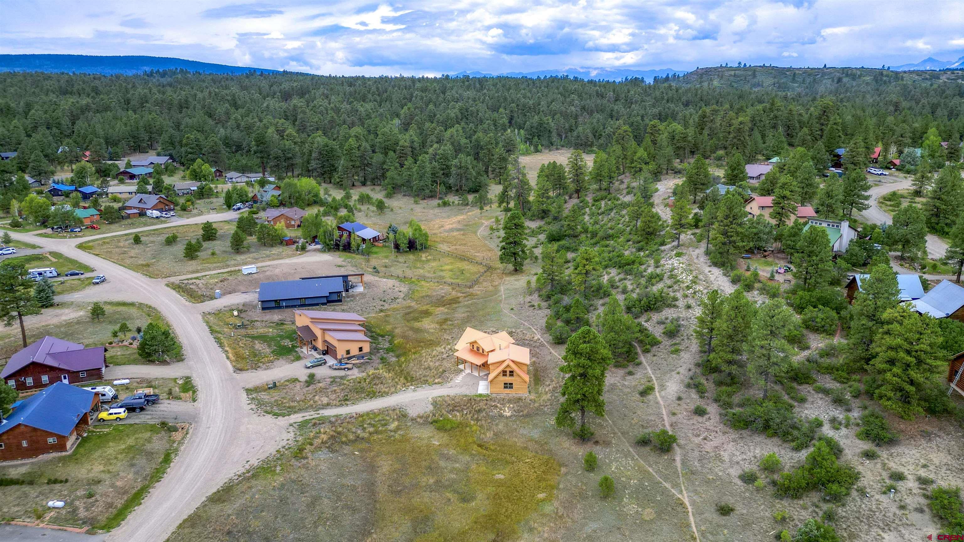 159 Snow Circle Pagosa Springs, CO 81147 - Photo 2 of 45 a view of a lake with couches and city view