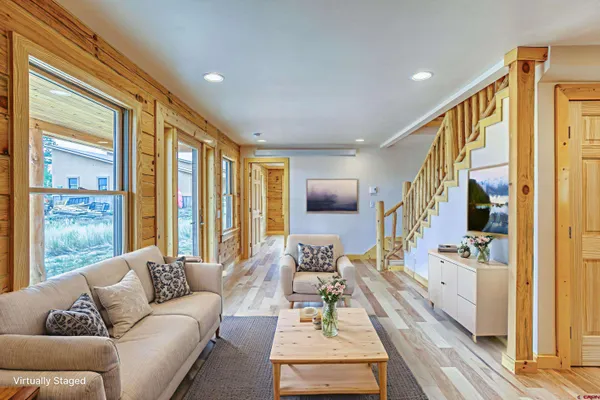 a view of livingroom with fireplace and wooden floor