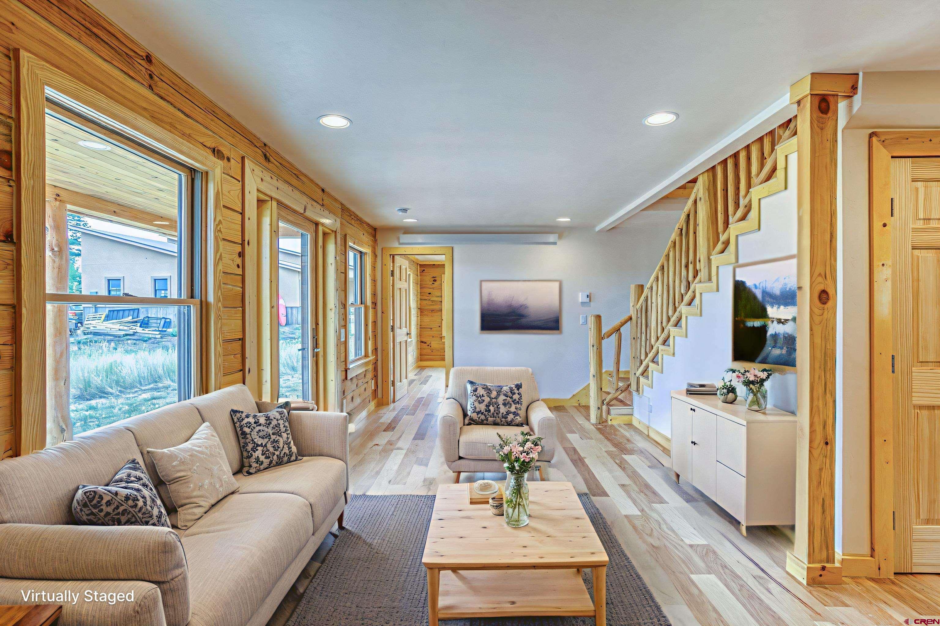 159 Snow Circle Pagosa Springs, CO 81147 - Photo 23 of 45 a living room with furniture and a large window