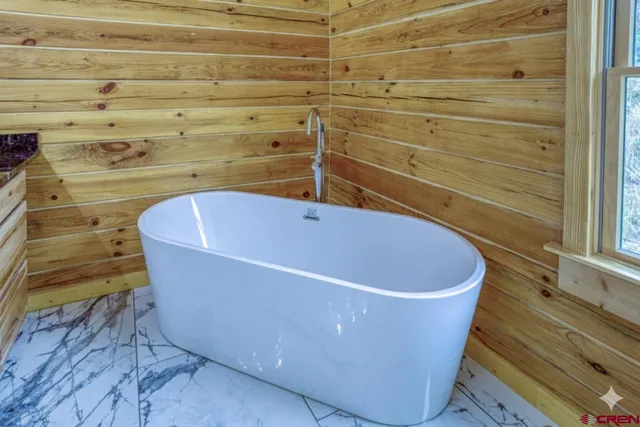 a view of a bathtub in a bathroom