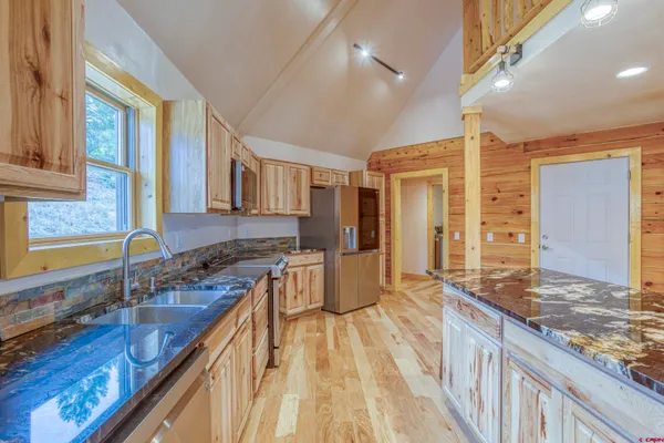 a view of a kitchen and dining room