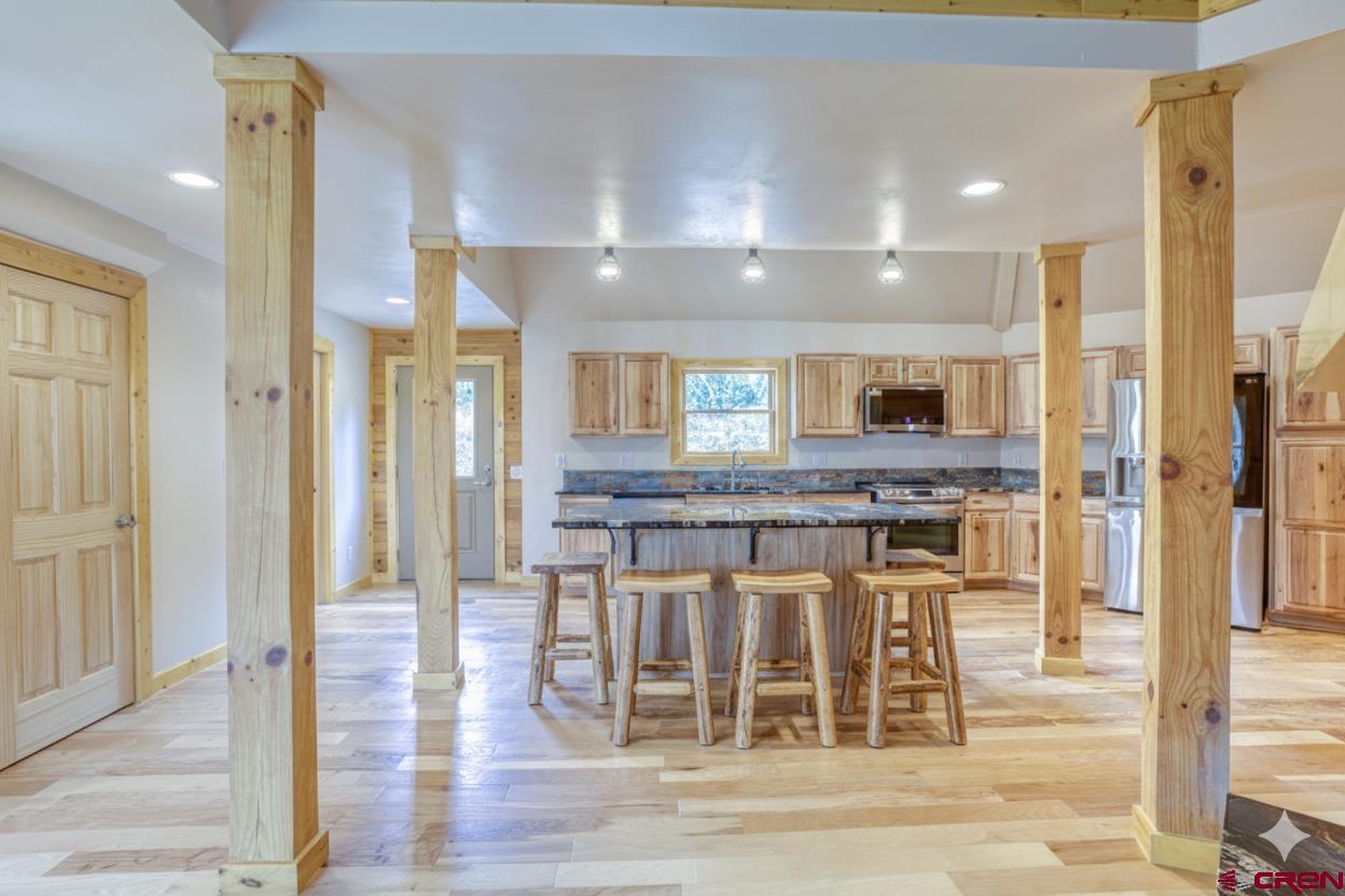 159 Snow Circle Pagosa Springs, CO 81147 - Photo 26 of 45 a view of a kitchen and dining room