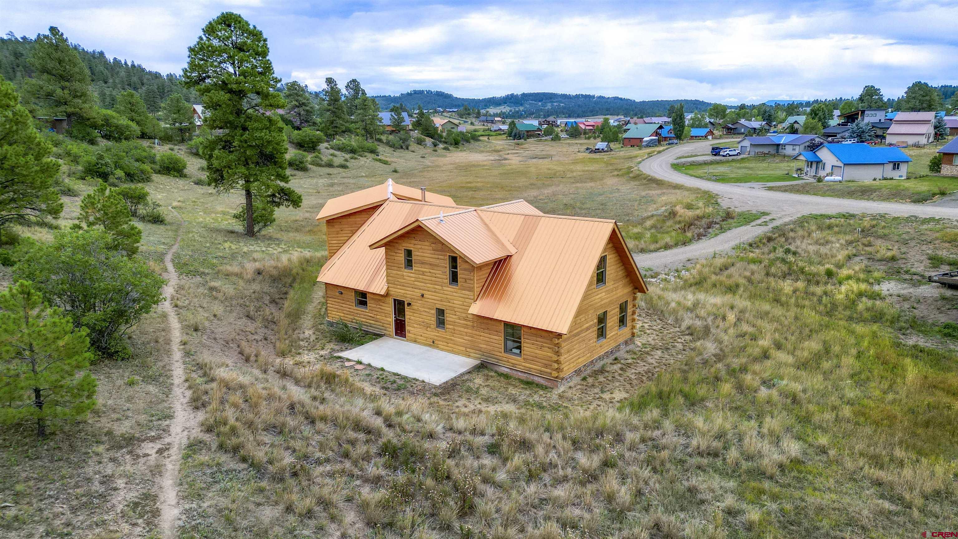 159 Snow Circle Pagosa Springs, CO 81147 - Photo 28 of 45 an aerial view of a house with lake view and boat