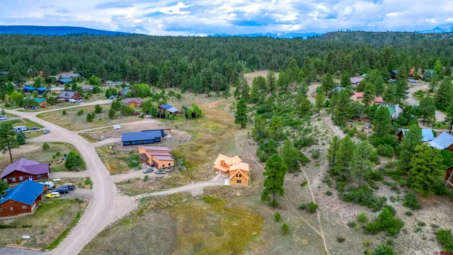 a view of a lake with couches and city view