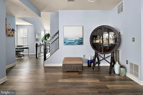 a view of a dining room with furniture wooden floor and chandelier
