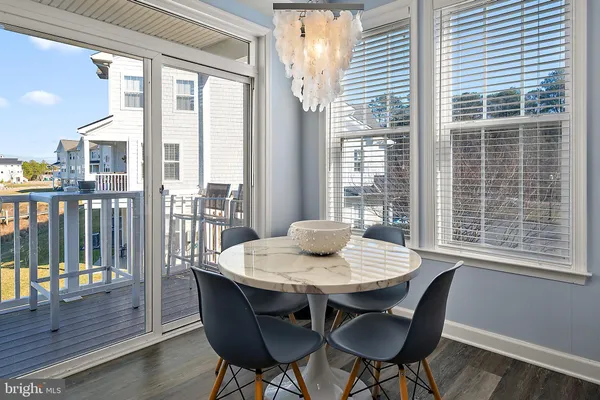 a bathroom with a granite countertop sink mirror and toilet