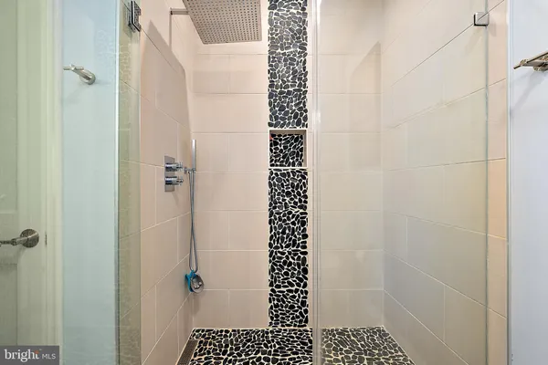 a bedroom with furniture and large window