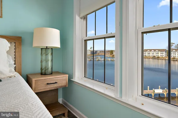 a living room with a bed and a rug