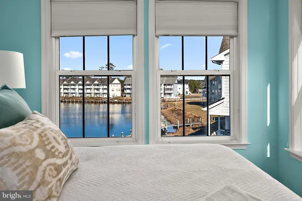 a bedroom with a bed and a rug