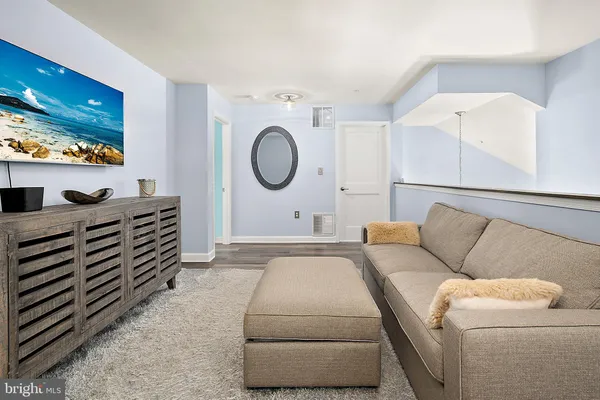a view of a lake with boats and large trees
