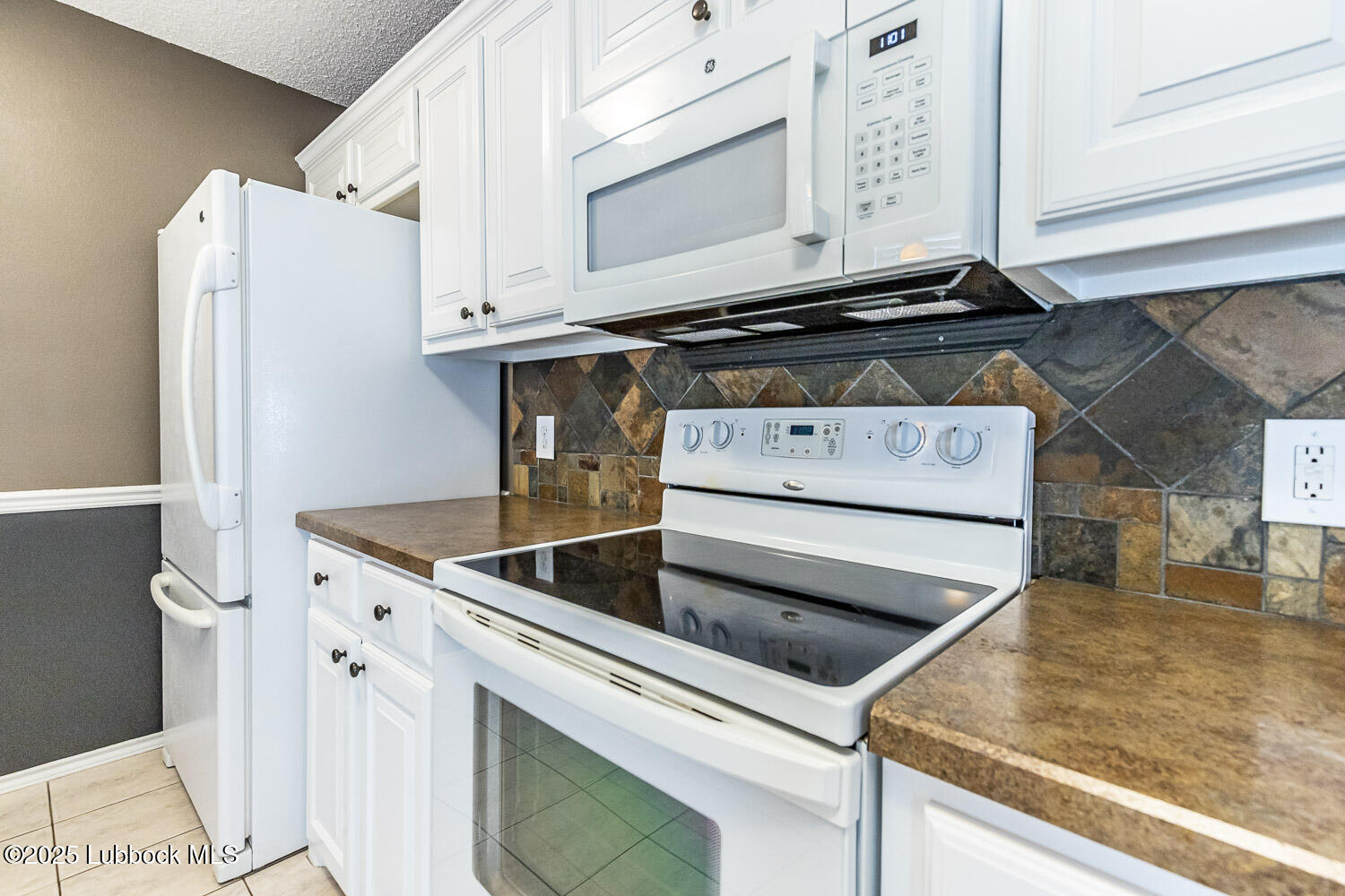 6120 7th Drive Lubbock, TX 79416 - Photo 13 of 33 a view of a kitchen with sink and washer