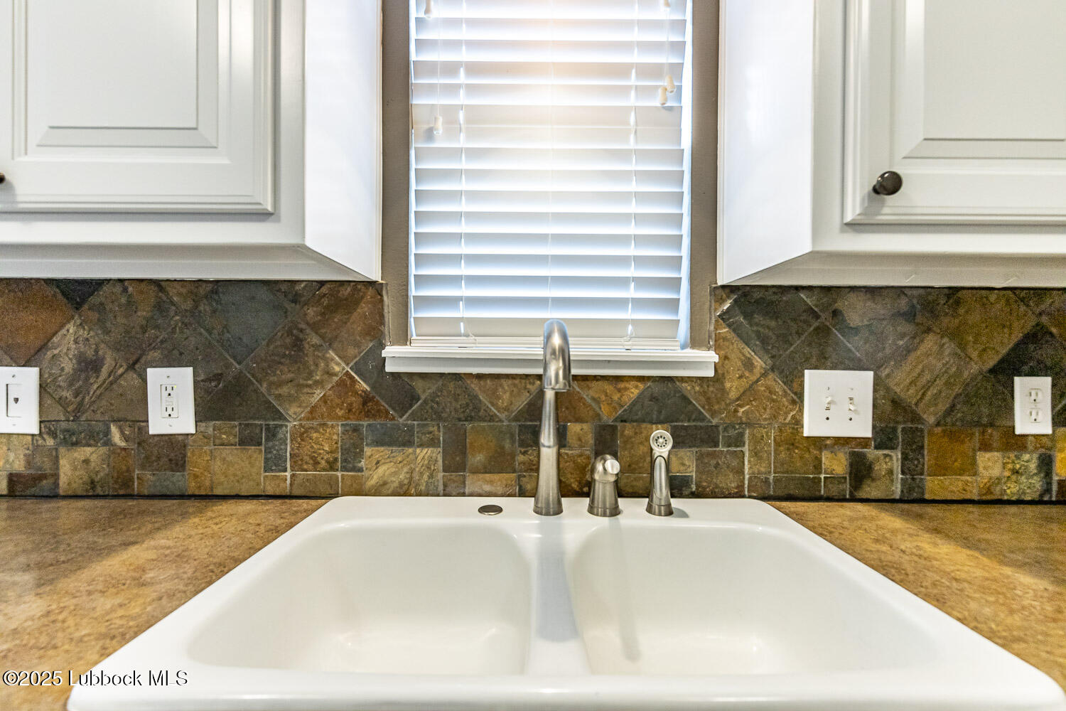 6120 7th Drive Lubbock, TX 79416 - Photo 14 of 33 a bedroom with a bed and a large window