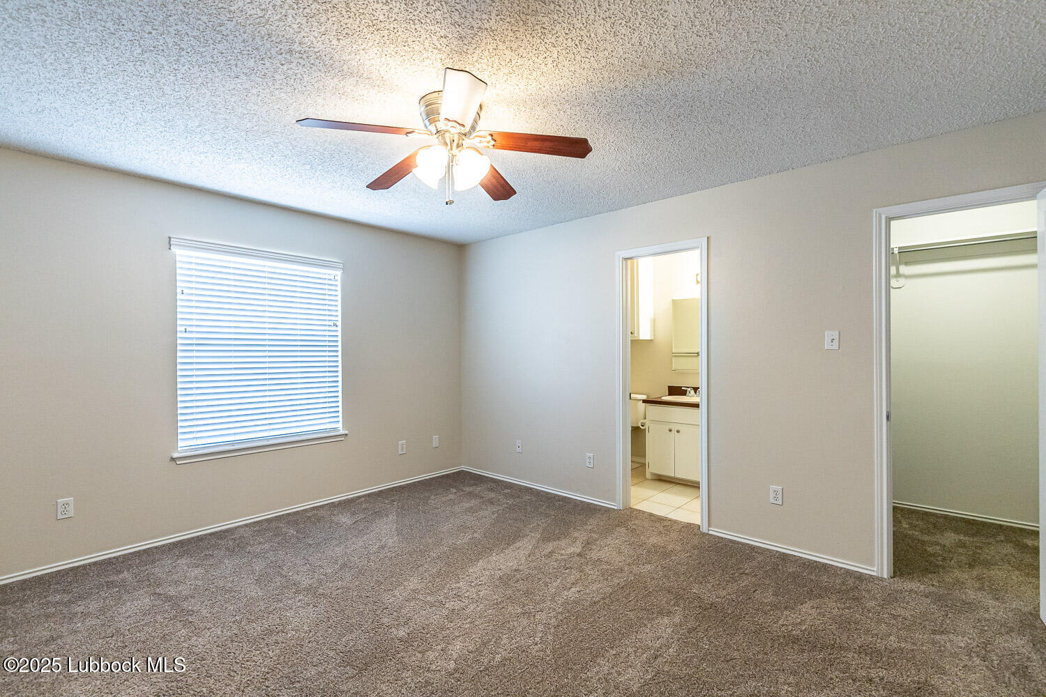 6120 7th Drive Lubbock, TX 79416 - Photo 18 of 33 a view of an empty room with a window